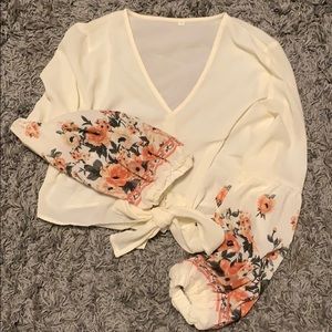 White shirt with floral sleeves. Never worn